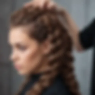 A stylist demonstrating the technique of braiding hair for wig creation.