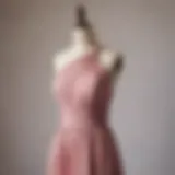 Elegant dusty rose bridesmaid dress on a mannequin