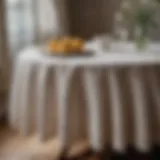 Elegant shabby chic round tablecloth draped on a rustic wooden table