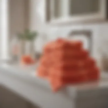 An aesthetically pleasing arrangement of coral washcloths in a modern bathroom setting.