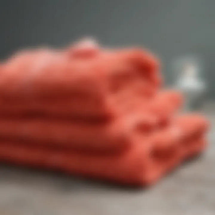 A vibrant coral washcloth displayed with natural elements to emphasize sustainable production.