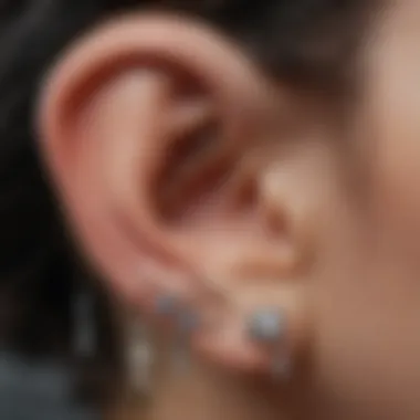 Close-up of a helix piercing embellished with jewelry