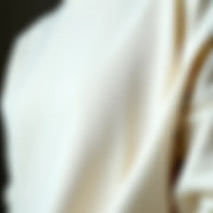 A close-up view of fabric draping and texture of a tight sweatshirt